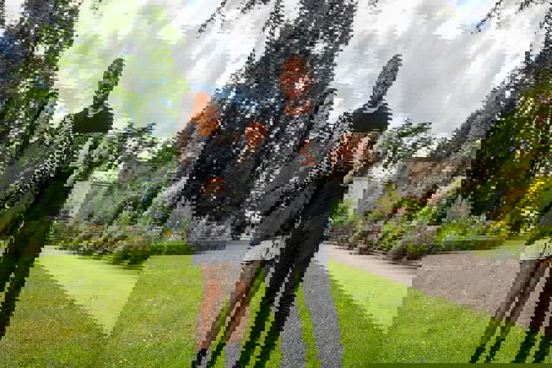 Couple Holding Child Smiling Chequered Tattoos