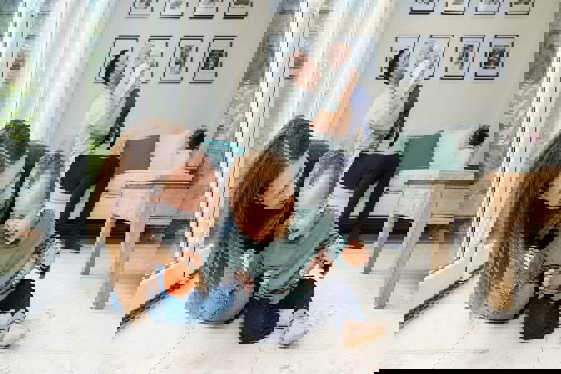 Woman Playing With Baby Man Holding Baby