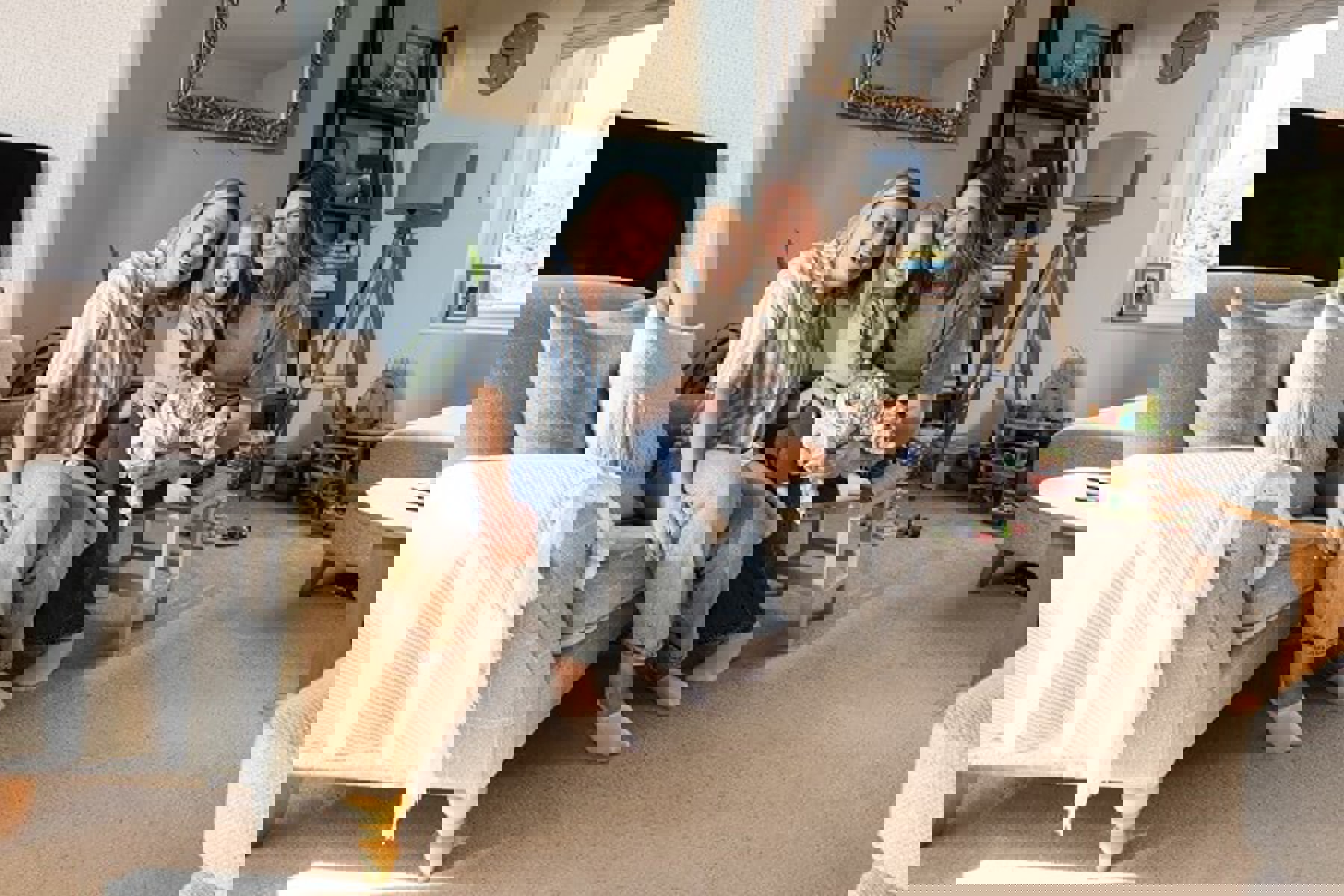 Couple In Living Room With Baby Toys