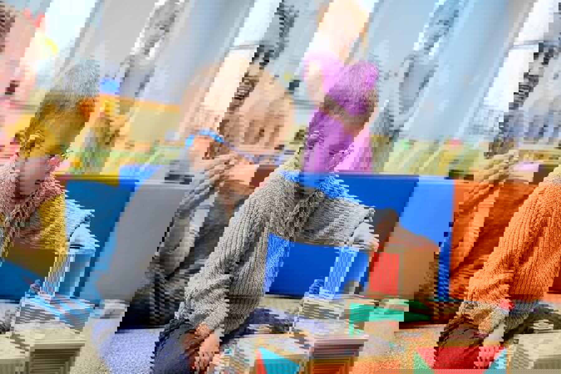 Baby Wearing Glasses Playing With Wooden Blocks