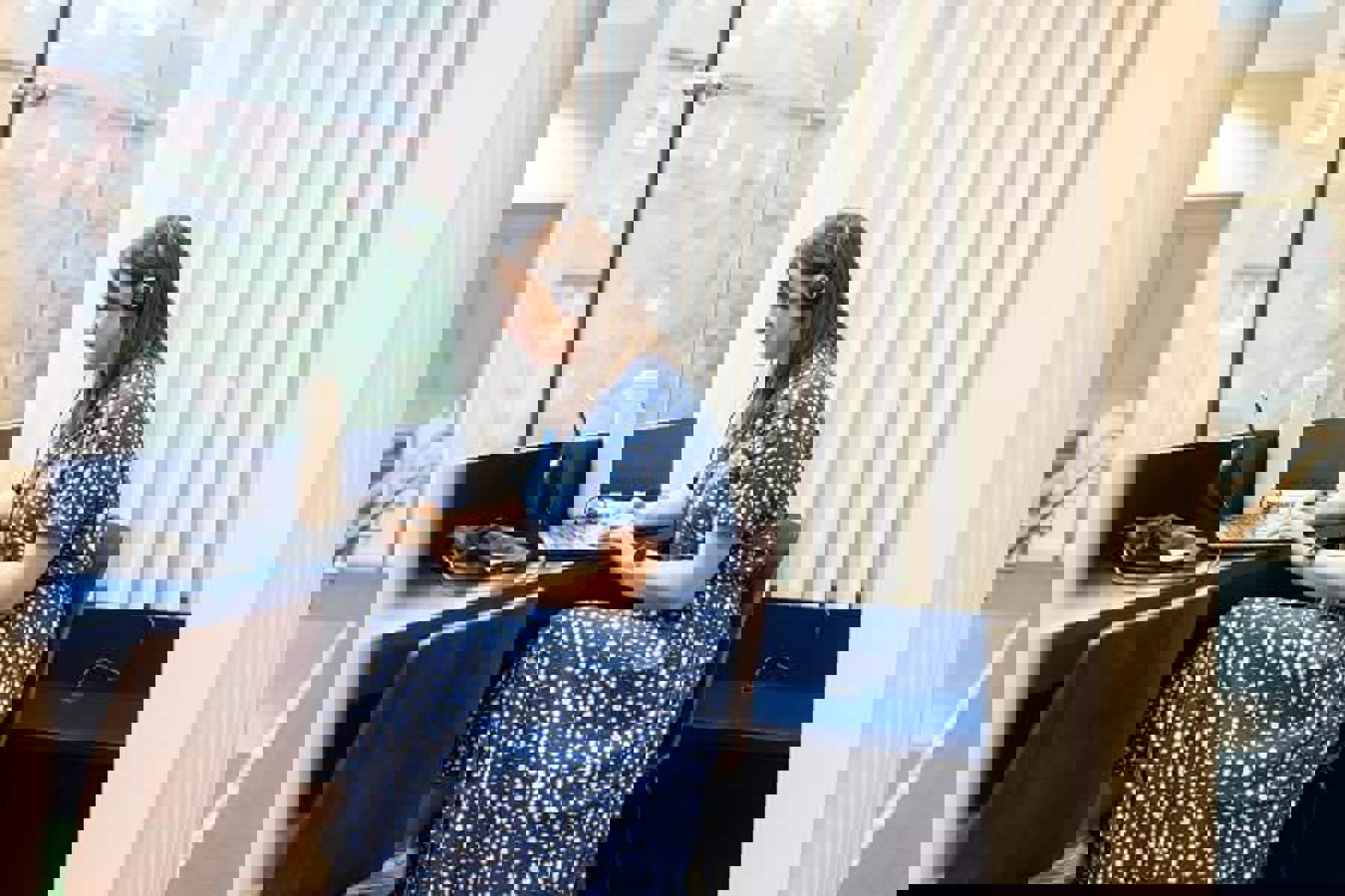 Colleage In Blue Red Looking At Laptop