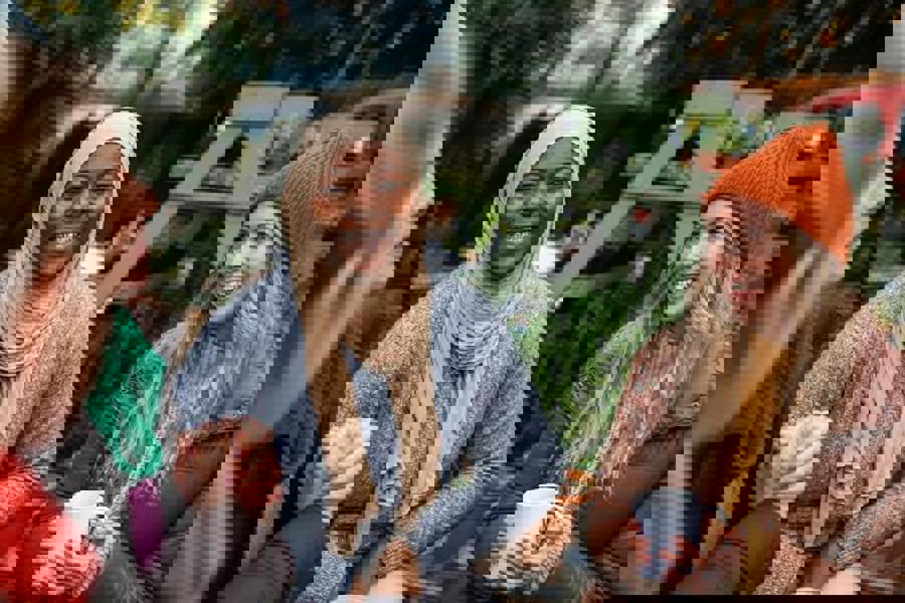 Women Sitting Outside Tea Orange Hat