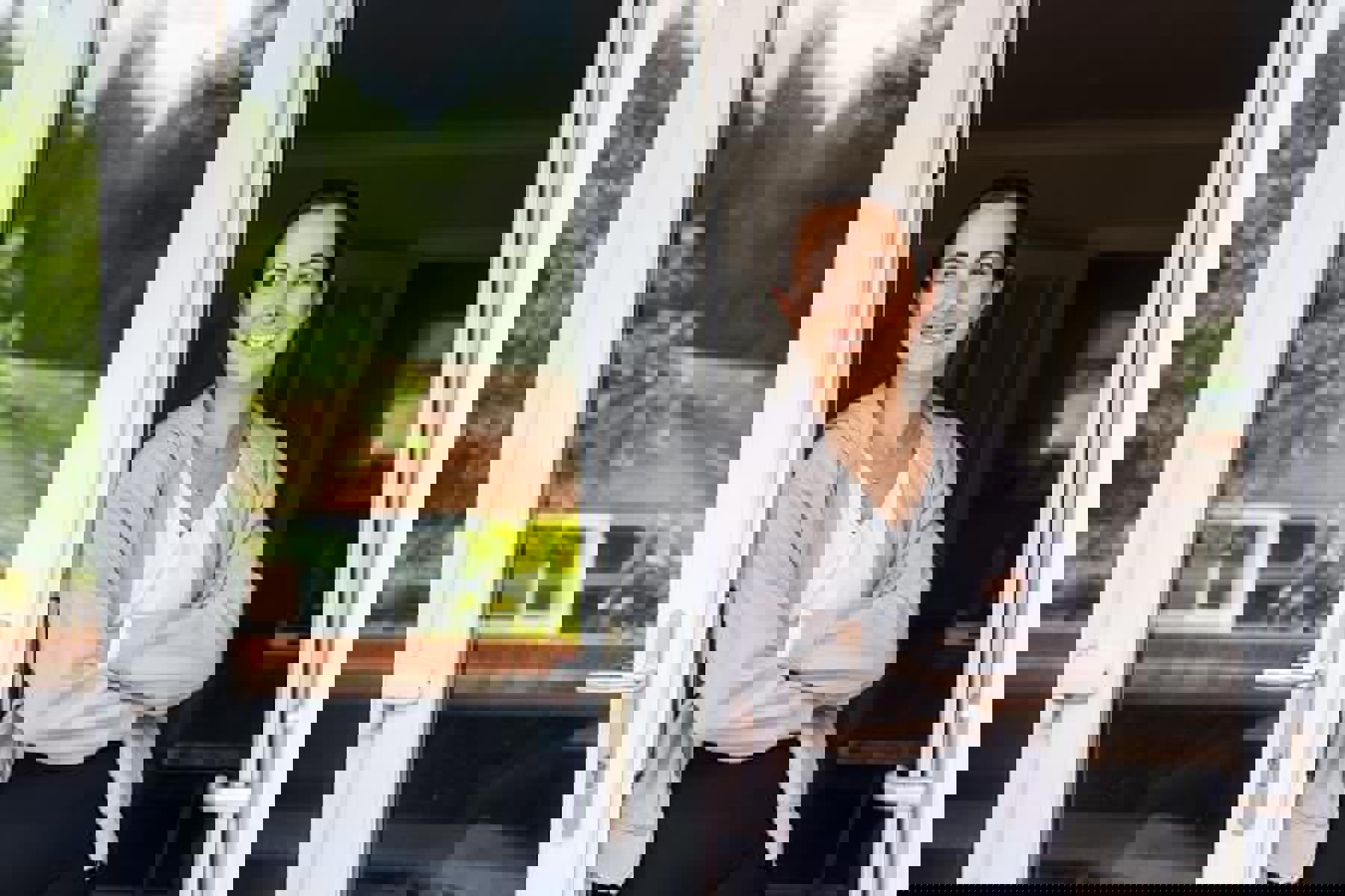 Woman Smiling At Conservatory Window