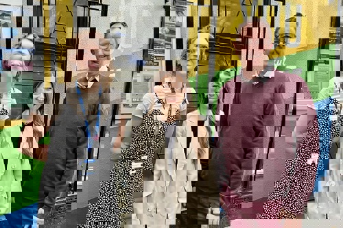 Nottingham Building Society colleague standing with Emmanuel House colleagues