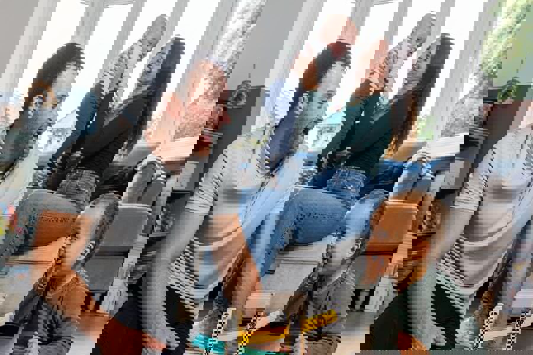 Family In Living Room Playing With Cars